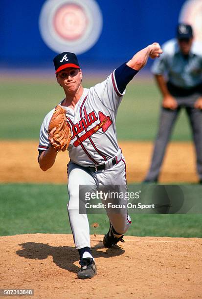 Tom Glavine of the Atlanta Braves pitches against the New York Mets during a Major League Baseball game circa 1990 at Shea Stadium in the Queens...