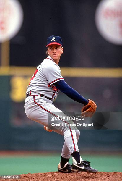 Tom Glavine of the Atlanta Braves pitches against the Philadelphia Phillies during a Major League Baseball game circa 1990 at Veterans Stadium in...