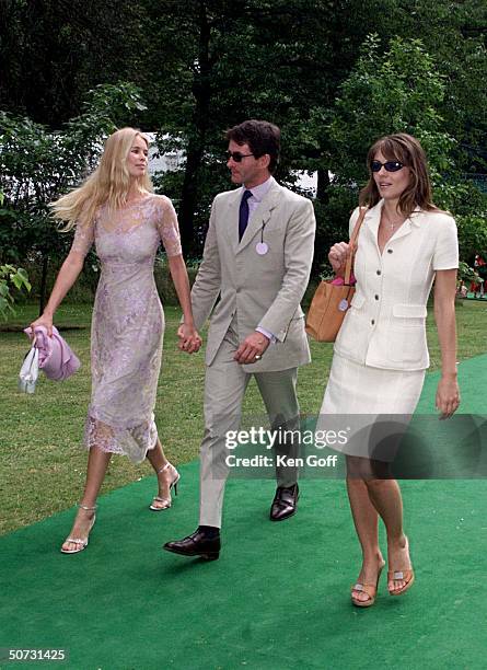 Model Claudia Schiffer & husband-to-be Tim Jeffries, with actress Elizabeth Hurley at charity tennis event at Buckingham Palace for the National...