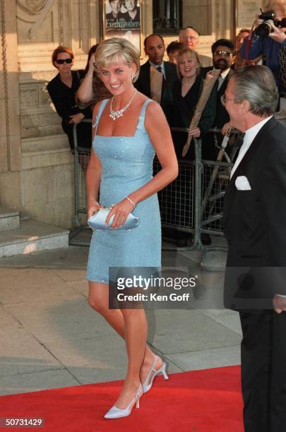 England's Princess Diana arriving in short light blue dress at the Royal Albert Hall for a performance of Swan Lake by the English National Ballet.