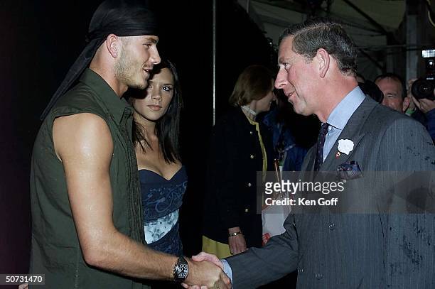 England's Prince Charles meeting singer Victoria ``Posh Spice'' Adams and her soccer star husband David Beckham at Party in the Park 2000.