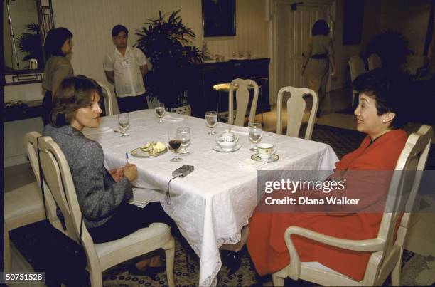 Correspondent Sandra Burton interviewing Philippine leader Corazon Aquino during informal luncheon.