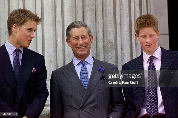 Britain's Prince William, father Prince Charles, and brother Prince Harry grinning in celebration of the Queen Mother's 100th birthday at Buckingham...