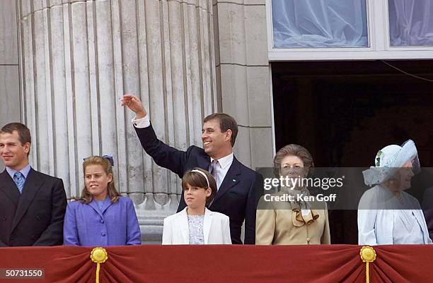 Peter Andrew Phillips, Princess Beatrice in purple, Prince Andrew , Princess Eugenie in white, and Princess Margaret in brown, celebrating w. The...