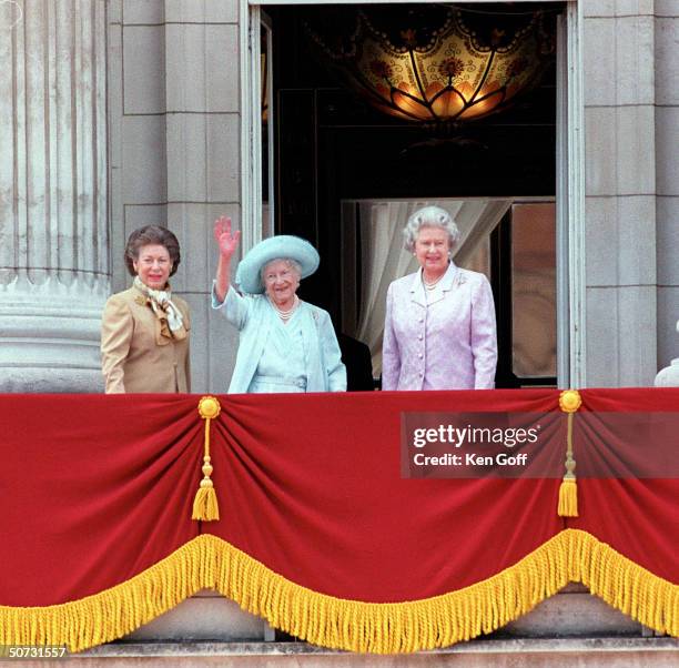 Britain's Queen Mother in blue hat and dress celebrating her 100th birthday w. Daughters Princess Margaret in brown and Queen Elizabeth II in...