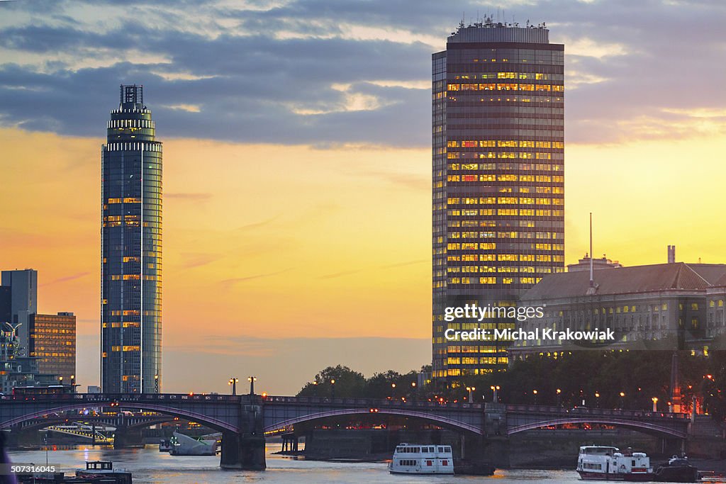 Cityscape of London with Lambeth Bridge and skyscrapers.