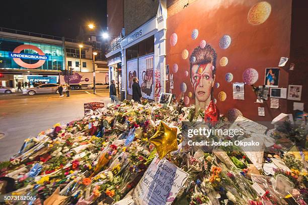 Flowers, letters and other tributes left on a mound continue to grow two weeks after the death of Brixton born English singer, songwriter David Bowie...