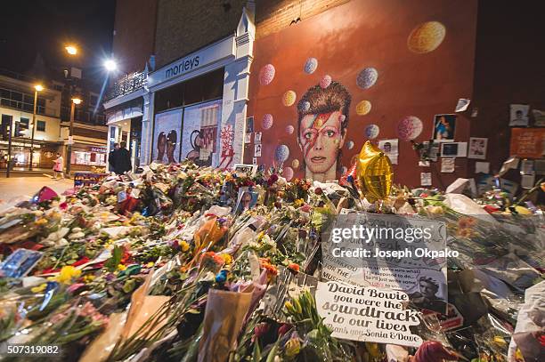 Flowers, letters and other tributes left on a mound continue to grow two weeks after the death of Brixton born English singer, songwriter David Bowie...