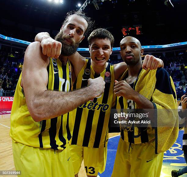 Luigi Datome, #70 of Fenerbahce Istanbul, Bogdan Bogdanovic, #13 of Fenerbahce Istanbul and Ricky Hickman, #3 of Fenerbahce Istanbul celebrate...