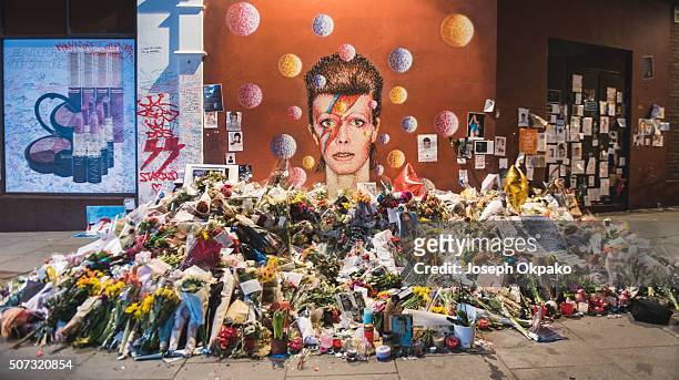 Flowers, letters and other tributes left on a mound continue to grow two weeks after the death of Brixton born English singer, songwriter David Bowie...