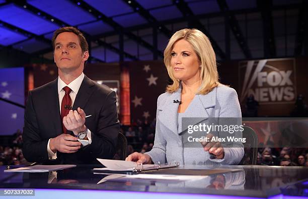 Moderators Martha MacCallum and Bill Hemmer wait for the beginning of the first forum of the Fox News - Google GOP Debate January 28, 2016 at the...