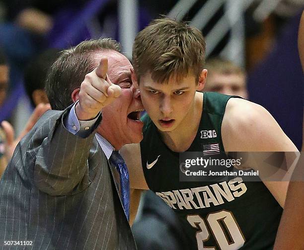 Head coach Tom Izzo of the Michigan State Spartans gets into the ear of Matt McQuaid during a game against the Northwestern Wildcats at Welsh-Ryan...