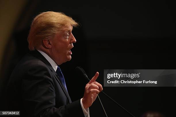 Republican presidential candidate Donald Trump gestures as he speaks to veterans at Drake University on January 28, 2016 in Des Moines, Iowa. Donald...