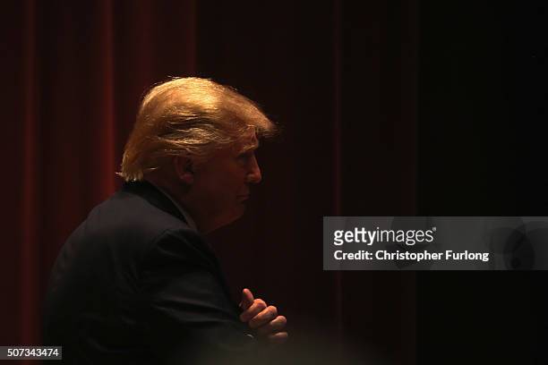 Republican presidential candidate Donald Trump walks off stage after speaking to veterans at Drake University on January 28, 2016 in Des Moines,...