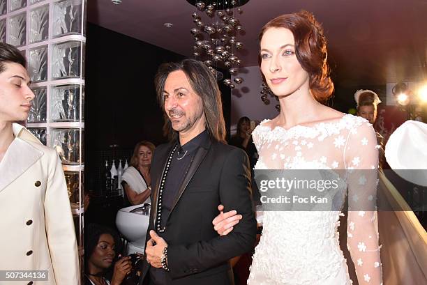 Fashion designer Jean Doucet and a 'Bride' walk the Runway during the Jean Doucet 'Bonheur Pour Tous' Gay and Lesbian Wedding dresses show as part of...