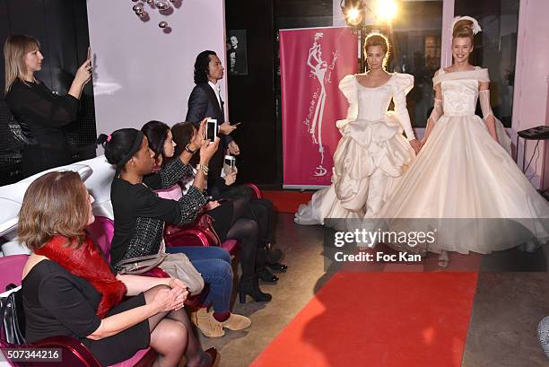 Couple' of models walk the Runway during the Jean Doucet 'Bonheur Pour Tous' Gay and Lesbian Wedding dresses show as part of Paris Fashion Week on...