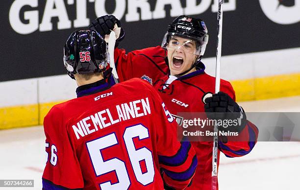 Ty Ronning of Team Cherry celebrates his goal against Team Orr with teammate Markus Niemelainen during the first period of their CHL/NHL Top...