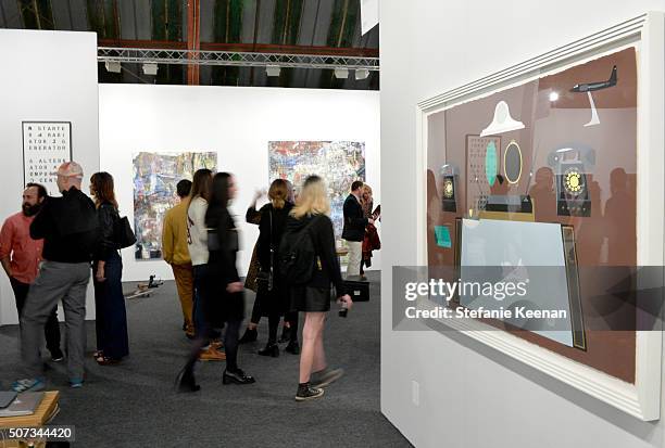 Guests attend the Art Los Angeles Contemporary 2016 Opening Night at Barker Hangar on January 28, 2016 in Santa Monica, California.