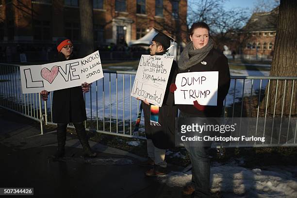 Protesters wait outside for the arrival of Republican presidential candidate Donald Trump who spoke to veterans at Drake University on January 28,...