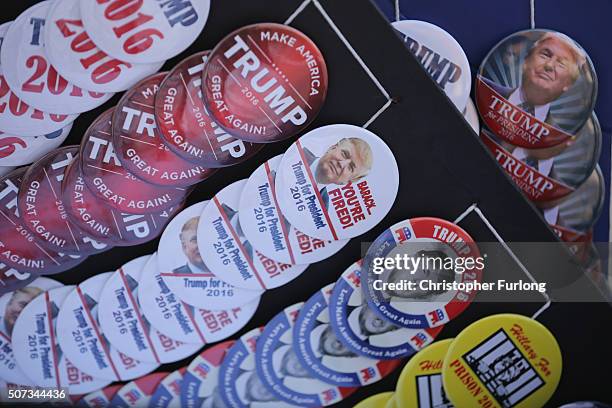 Trump 2016 button badhges are seen fo sale as people wait in line to see Republican presidential candidate Donald Trump address veterans at Drake...