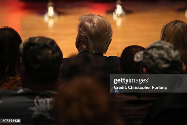 Republican presidential candidate Donald Trump sits in the audience during his "Rally to Benefit Veterans"at Drake University on January 28, 2016 in...