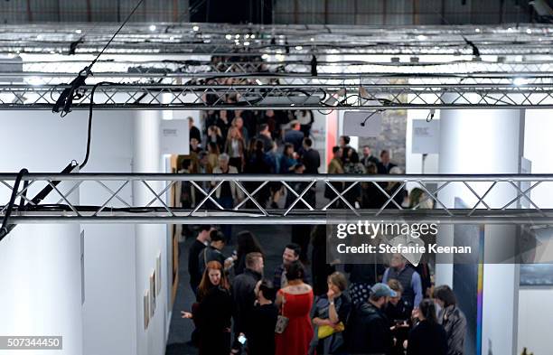 Guests attend the Art Los Angeles Contemporary 2016 Opening Night at Barker Hangar on January 28, 2016 in Santa Monica, California.