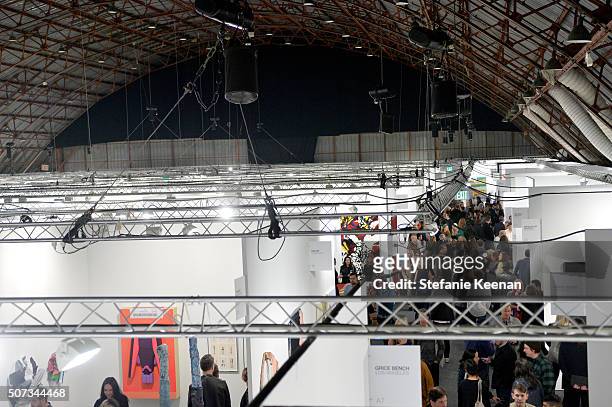 Guests attend the Art Los Angeles Contemporary 2016 Opening Night at Barker Hangar on January 28, 2016 in Santa Monica, California.