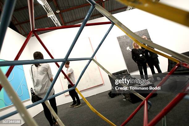 Guests attend the Art Los Angeles Contemporary 2016 Opening Night at Barker Hangar on January 28, 2016 in Santa Monica, California.