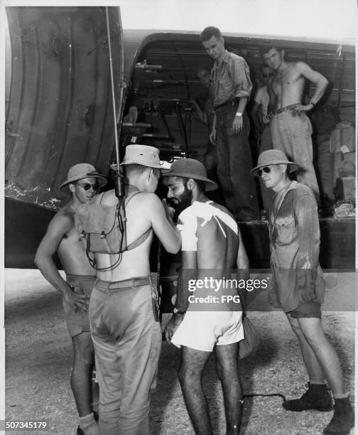 Marine Platoon Sergeant Chris Campisi is interviewed by Sergeant Marion D Bailey in the field during World War Two, Bougainville, Papua New Guinea,...