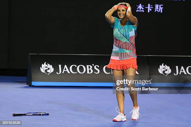 Sania Mirza of India celebrates winning championship point in her women's doubles final match with Martina Hingis of Switzerland against Andrea...