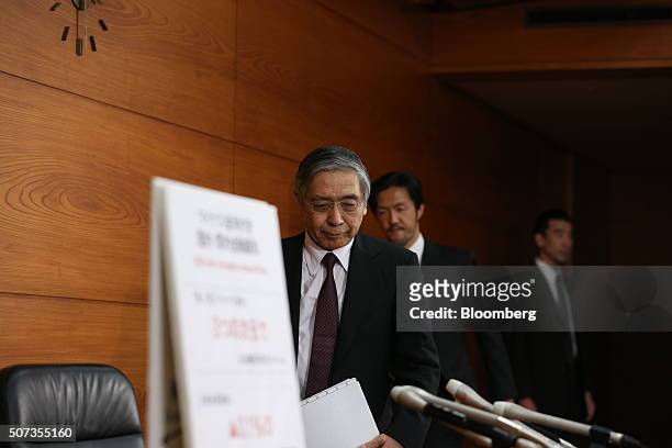 Haruhiko Kuroda, governor of the Bank of Japan , arrives at a news conference at the central bank's headquarters in Tokyo, Japan, on Friday, Jan. 29,...