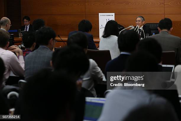 Haruhiko Kuroda, governor of the Bank of Japan , smiles during a news conference at the central bank's headquarters in Tokyo, Japan, on Friday, Jan....