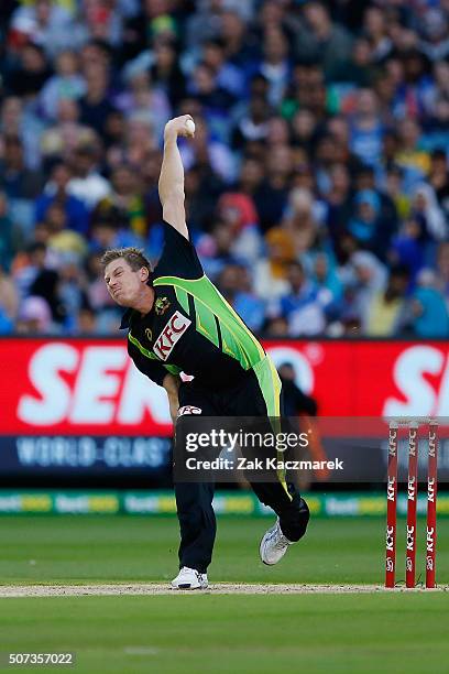 James Faulkner of Australia bowls during the International Twenty20 match between Australia and India at Melbourne Cricket Ground on January 29, 2016...