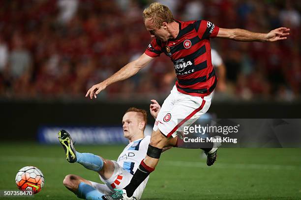 Mitch Nichols of the Wanderers beats Jack Clisby of Melbourne City to score the first goal during the round 17 A-League match between the Western...