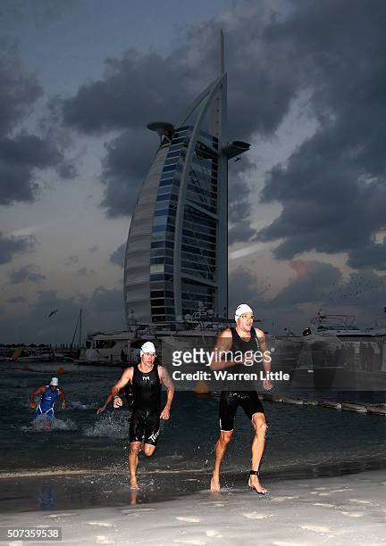 Jan Frodeno of Germany and Josh Amberger of Australia leave the water en route to finishing first and second respectively in the Men's the Men's...