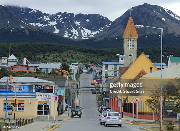 View down one of the main streets in Ushuaia, Argentina, towards colourful houses and the church.