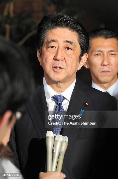 Prime Minister Shinzo Abe speaks to media reporters after Economy Rivitalization minister Akira Amari announces his resignation at his official...