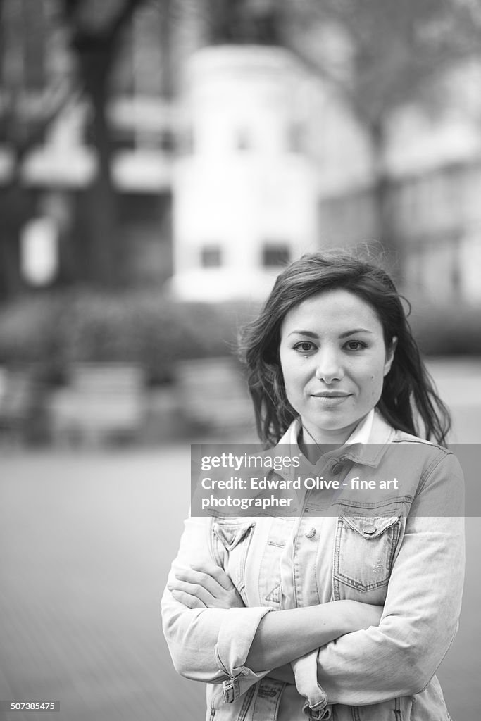 Young woman in street in denim jacket