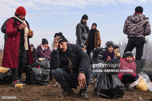 Migrants rest after crossing the Macedonian border into Serbia, near the village of Miratovac, on January 29, 2016. More than one million people...