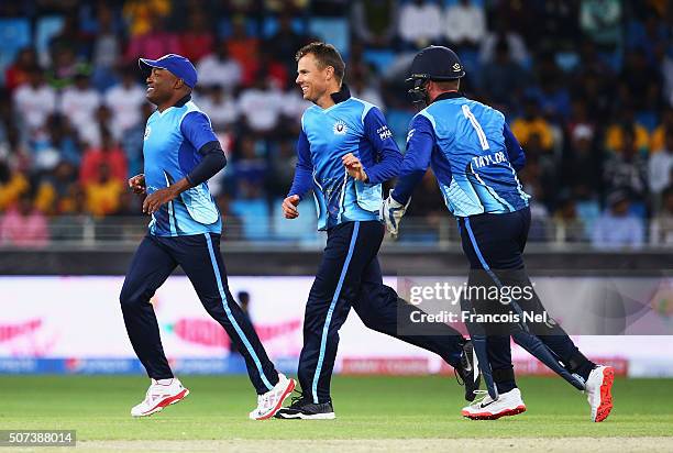 Johan Botha of Leo Lions celebrates the wicket of Chamara Silva of Capricorn Commanders with team mates Brian Lara and Brendan Taylor during the...