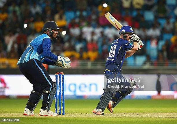 Paul Collingwood of Capricorn Commanders hits out watched by Brendan Taylor of Leo Lions during the Oxigen Masters Champions League 2016 match...