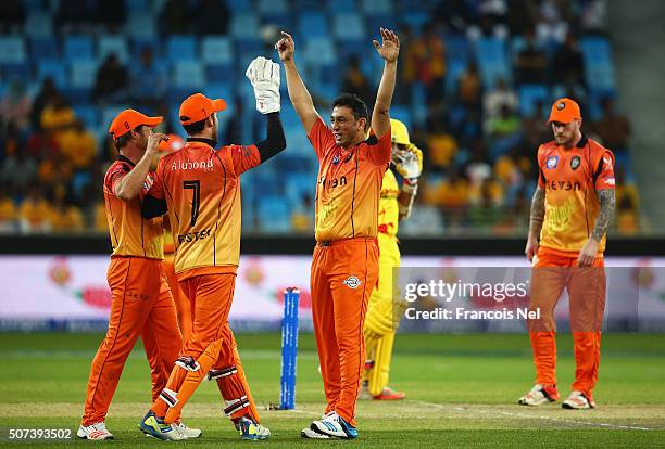 Azhar Mahmood of Virgo Super Kings celebrates taking the wicket of Adam Gilchrist of Sagittarius Strikers during the Oxigen Masters Champions League...