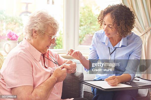 fall sensor pendant for senior woman - pendant necklace stock pictures, royalty-free photos & images