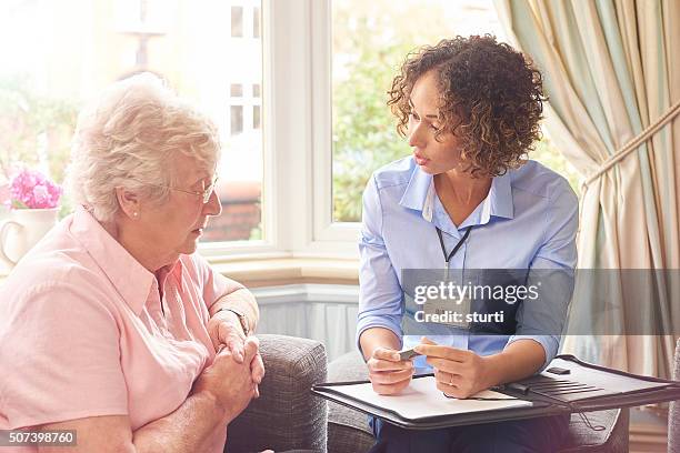 fall sensor pendant for senior woman - motion detector stock pictures, royalty-free photos & images