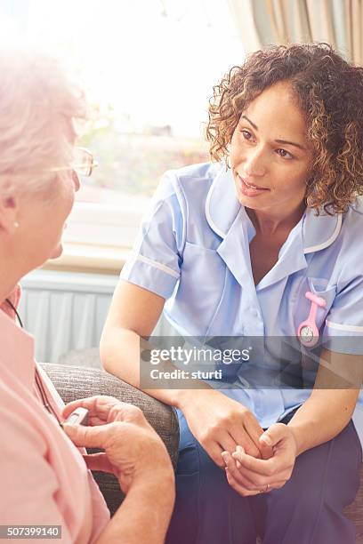 home carer visit - motion detector stock pictures, royalty-free photos & images