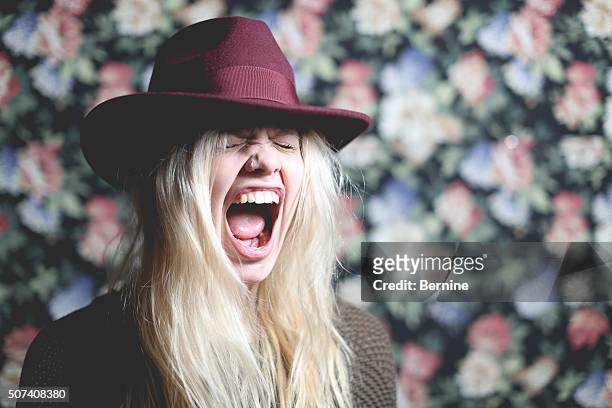 young adult female with mouth wide open and eyes closed - bleached hair stock-fotos und bilder