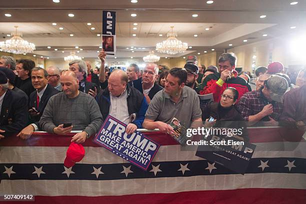 Supporters of Republican presidential candidate Donald Trump wait for him to come sign items after a Town Hall on January 29, 2016 in Nashua, New...