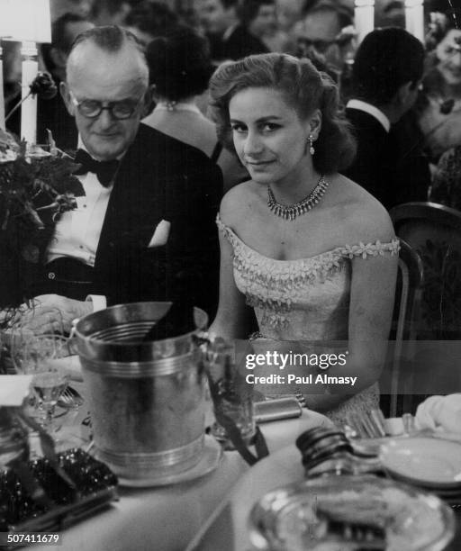 Athina Livanos, wife of ship owner Aristotle Onassis, attending a dinner, 1960.