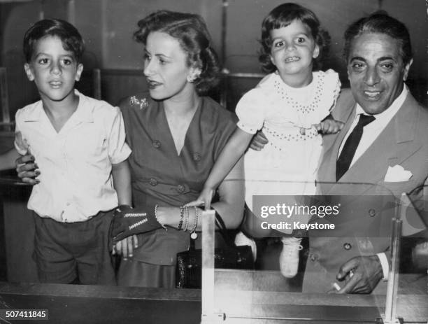 Athina Livanos and her husband Aristotle Onassis, with their children Alexander and Christina, attending the launch of the biggest tanker in the...