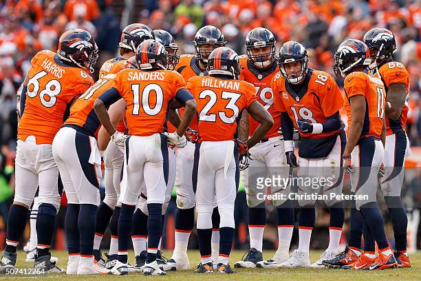 Quarterback Peyton Manning of the Denver Broncos talks with his team in the huddle during the AFC Championship game New England Patriots aat Sports...